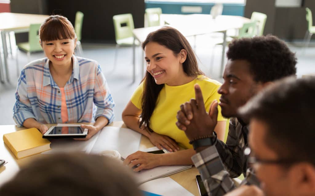 stock image of students at a table
