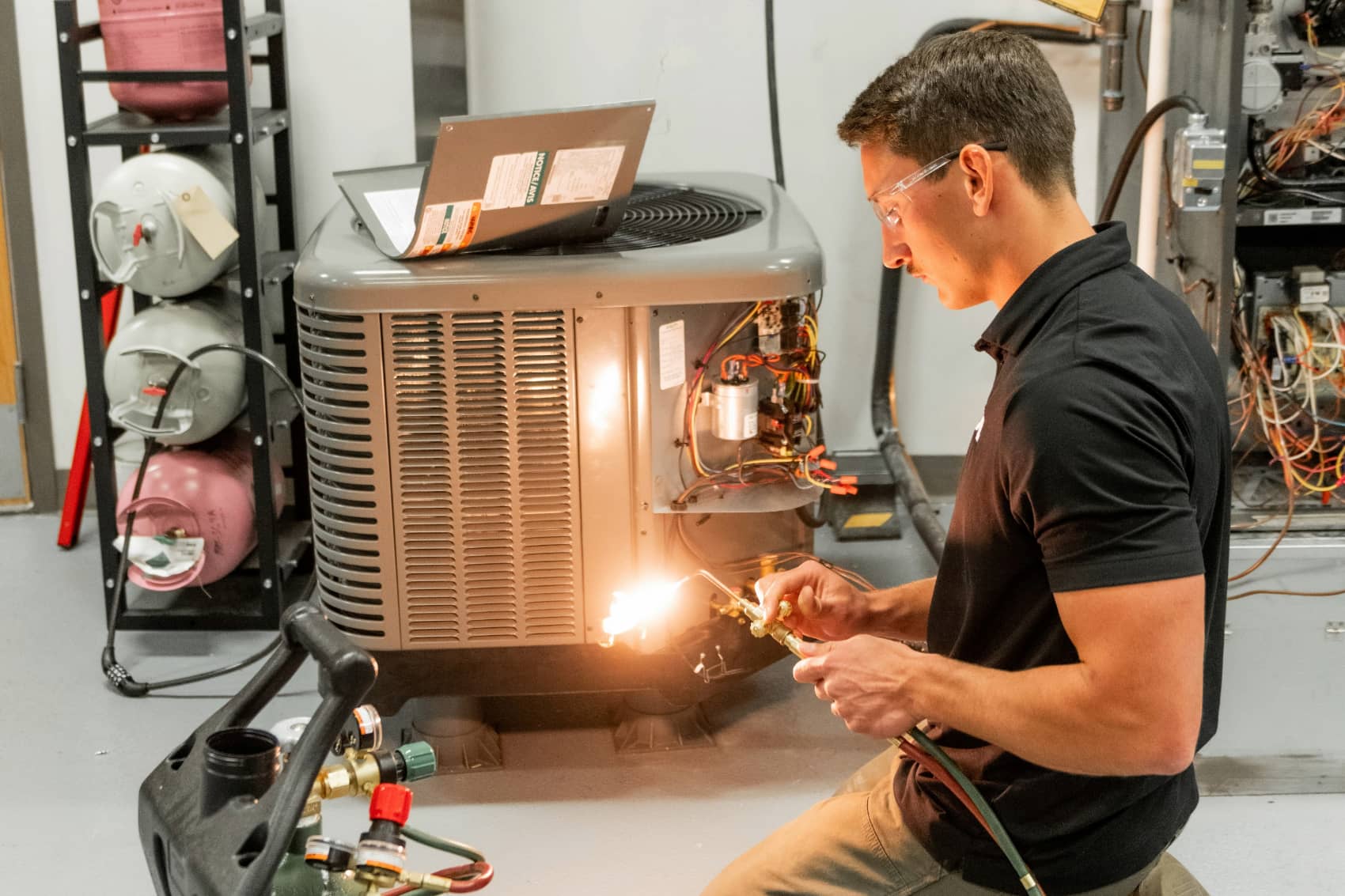 Student working on an air conditioning unit