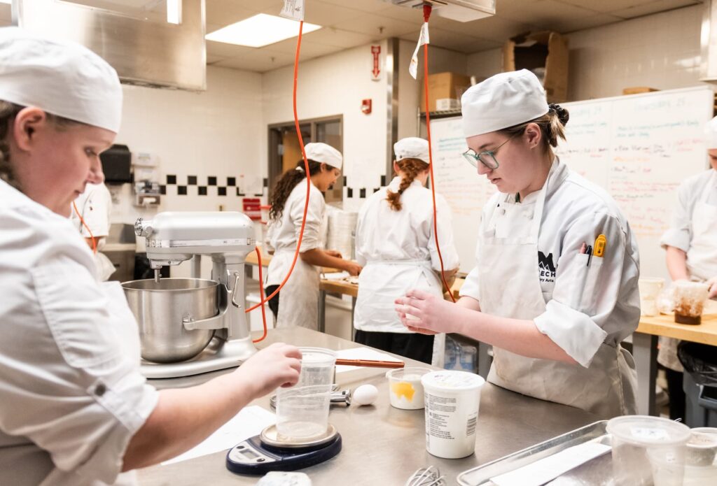 Culinary students cooking in class