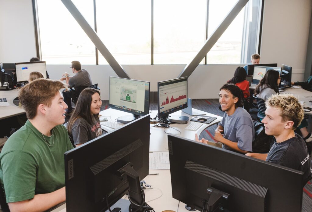 Students collaborating in a computer lab