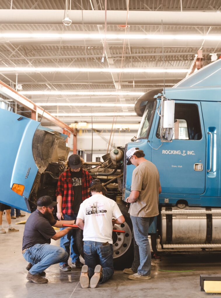 Students and instructor working on a diesel truck