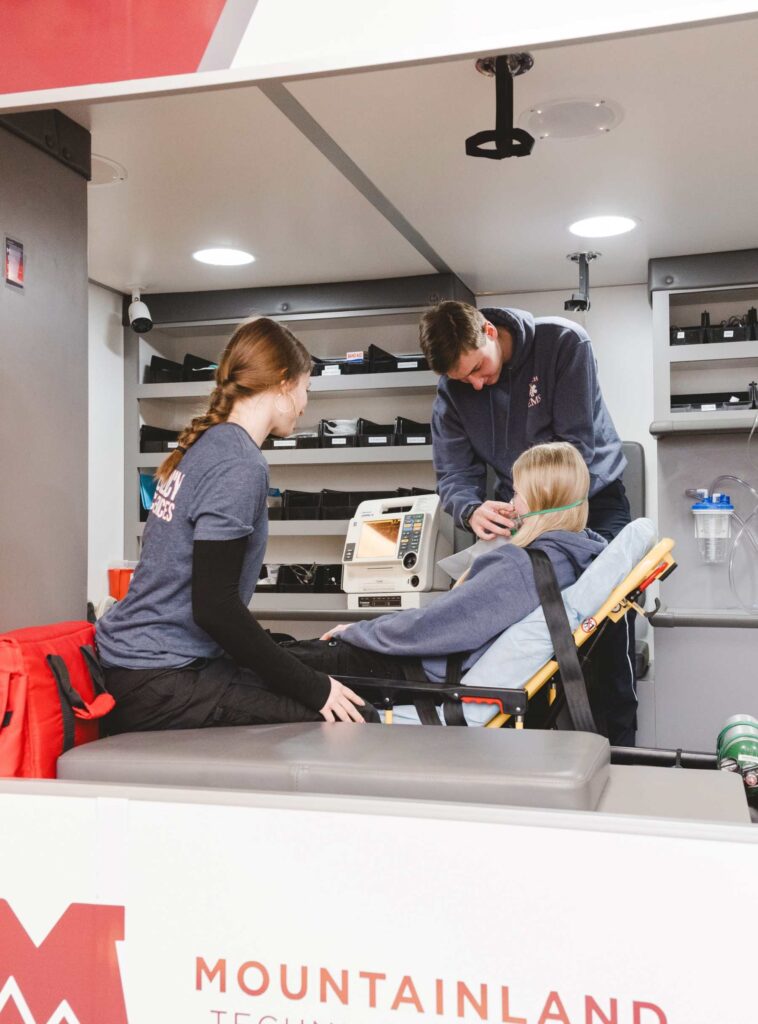 EMT Students training in a mock ambulance
